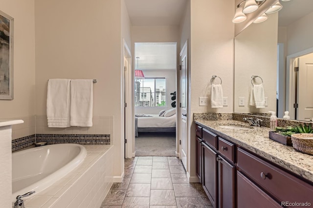504 E Dry Creek Pl, Littleton, CO 80122 - ensuite bathroom featuring vanity, a bath, and baseboards