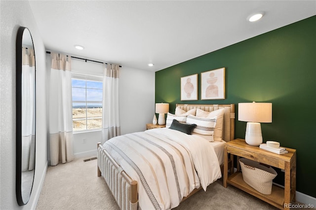 carpeted bedroom with recessed lighting, baseboards, and visible vents