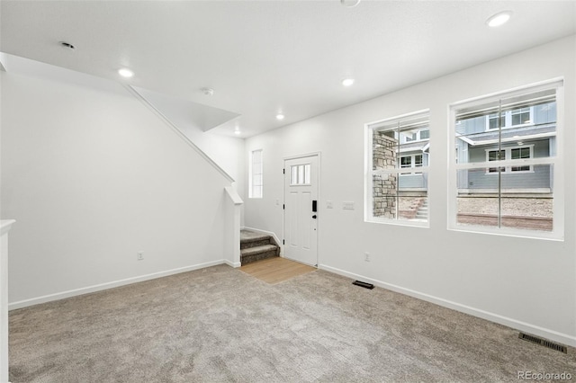 17117 W 91st Ln, Arvada, CO 80007 - foyer entrance with carpet, stairs, baseboards, and recessed lighting