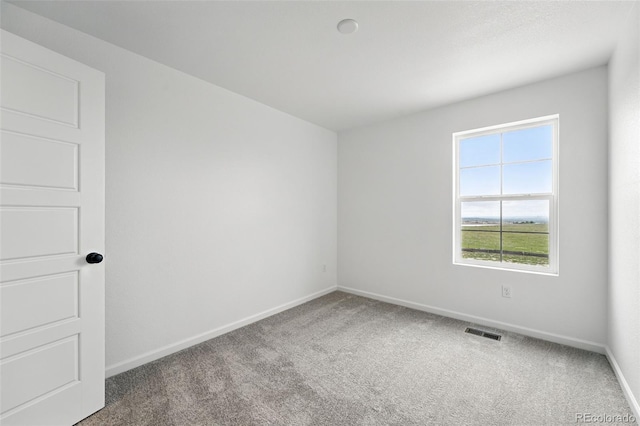 17117 W 91st Ln, Arvada, CO 80007 - carpeted spare room featuring baseboards