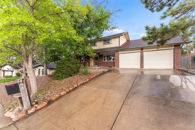 445 Wintery Cir, Colorado Springs, CO 80919 - traditional home featuring brick siding, an attached garage, and concrete driveway
