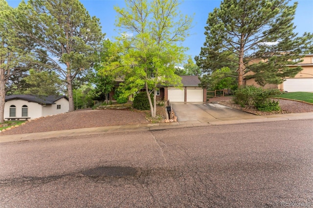 445 Wintery Cir, Colorado Springs, CO 80919 - view of front of property featuring driveway and a garage