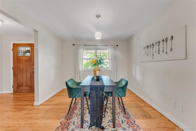 445 Wintery Cir, Colorado Springs, CO 80919 - dining area featuring light wood-style flooring and baseboards