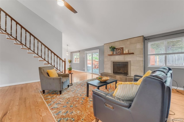 445 Wintery Cir, Colorado Springs, CO 80919 - living area featuring ceiling fan, wood finished floors, baseboards, stairway, and lofted ceiling