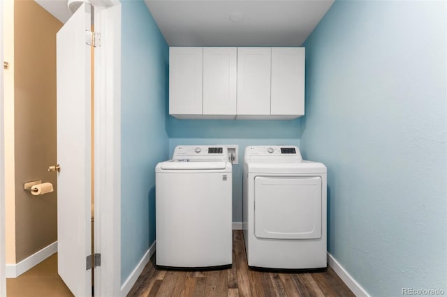 445 Wintery Cir, Colorado Springs, CO 80919 - washroom with cabinet space, washer and dryer, wood finished floors, and baseboards