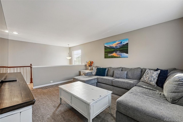 carpeted living area featuring baseboards