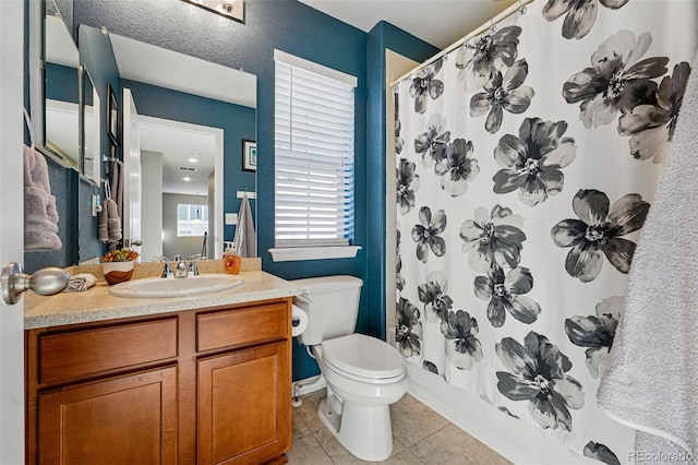 bathroom featuring toilet, tile patterned floors, vanity, and a shower with curtain