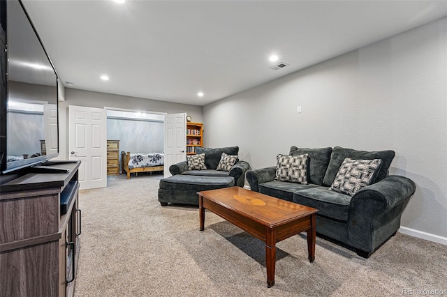 living room featuring light carpet, recessed lighting, visible vents, and baseboards