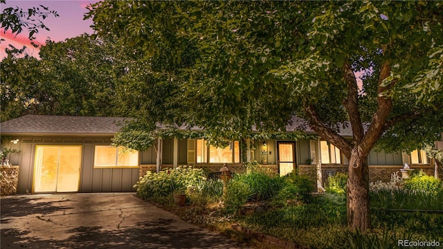 1315 Tipperary St, Boulder, CO 80303 - view of front facade featuring concrete driveway and a shingled roof