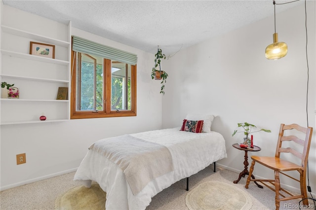1315 Tipperary St, Boulder, CO 80303 - carpeted bedroom with a textured ceiling and baseboards
