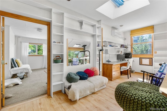 1315 Tipperary St, Boulder, CO 80303 - home office featuring a wall mounted AC, light wood-style flooring, and a skylight