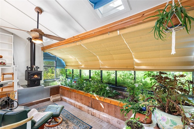 1315 Tipperary St, Boulder, CO 80303 - sunroom with vaulted ceiling, a wood stove, ceiling fan, and a skylight