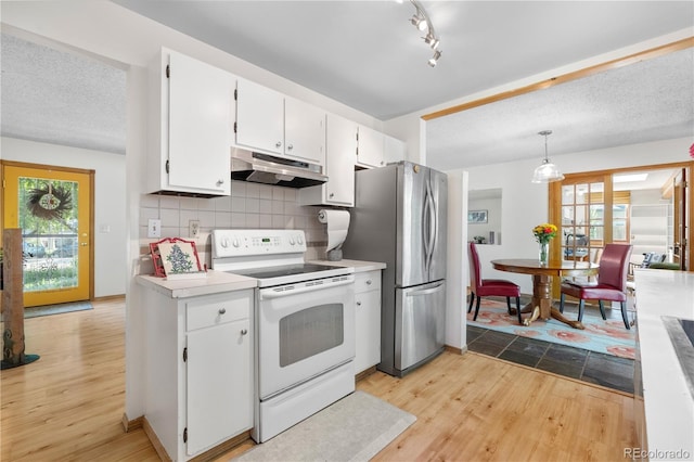 1315 Tipperary St, Boulder, CO 80303 - kitchen featuring electric range, under cabinet range hood, light wood-type flooring, and healthy amount of natural light