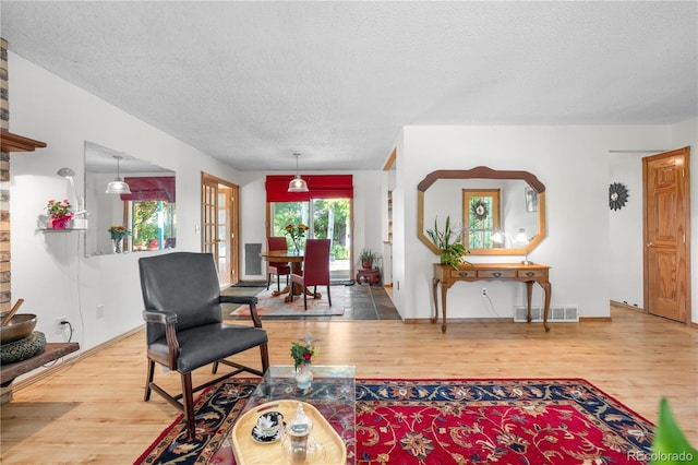 1315 Tipperary St, Boulder, CO 80303 - living area with wood finished floors and a textured ceiling