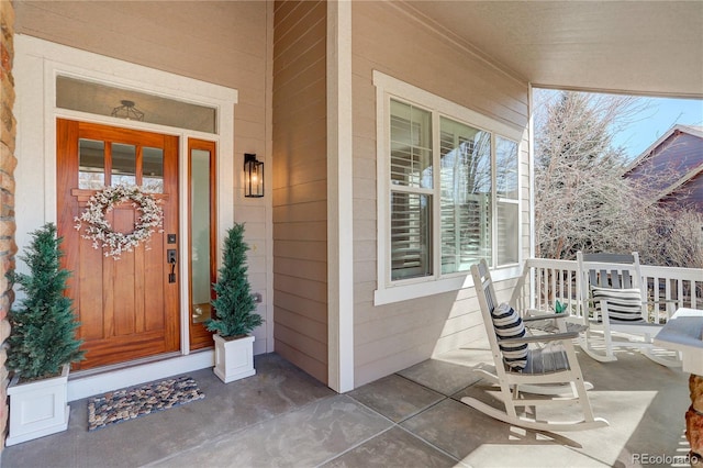 property entrance featuring covered porch