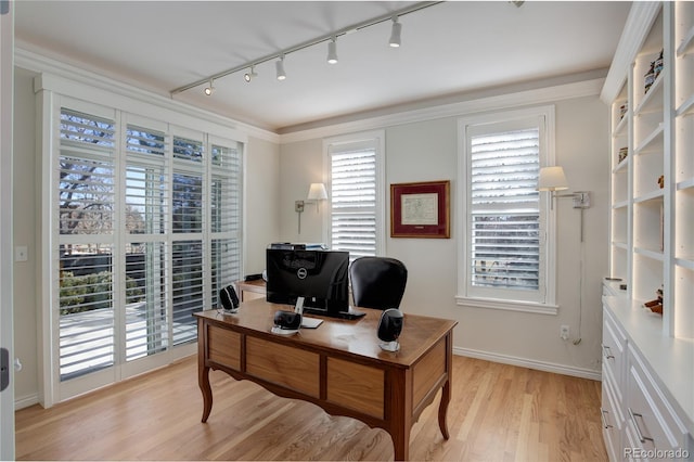 office area with ornamental molding, light wood-type flooring, and baseboards