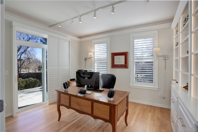 office space featuring light wood-style floors and baseboards