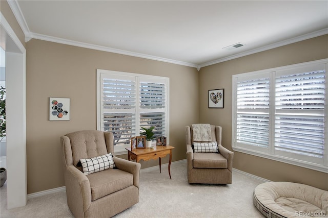 sitting room featuring light carpet, crown molding, and baseboards