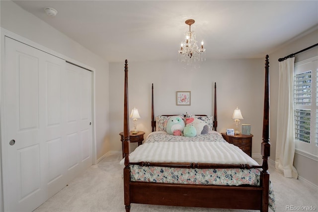 bedroom featuring light carpet, baseboards, and a notable chandelier