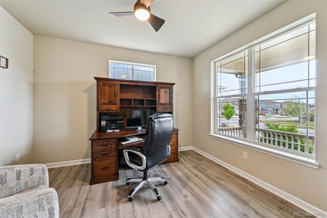 13113 W 73rd Ave, Arvada, CO 80005 - office space featuring light wood-style flooring, a ceiling fan, and baseboards