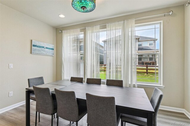 13113 W 73rd Ave, Arvada, CO 80005 - dining room featuring baseboards, wood finished floors, and recessed lighting