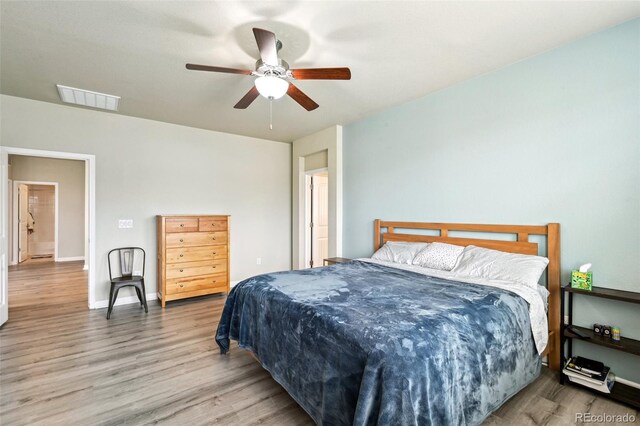 13113 W 73rd Ave, Arvada, CO 80005 - bedroom featuring wood finished floors, visible vents, and a ceiling fan