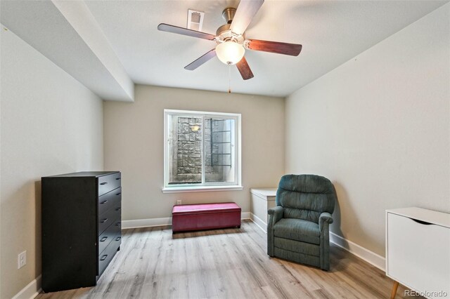 13113 W 73rd Ave, Arvada, CO 80005 - living area with baseboards, visible vents, light wood-style floors, and ceiling fan
