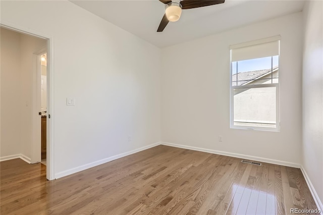 spare room with ceiling fan and light hardwood / wood-style flooring