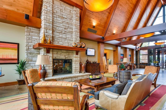 tiled living room with a stone fireplace, beamed ceiling, high vaulted ceiling, and wooden ceiling