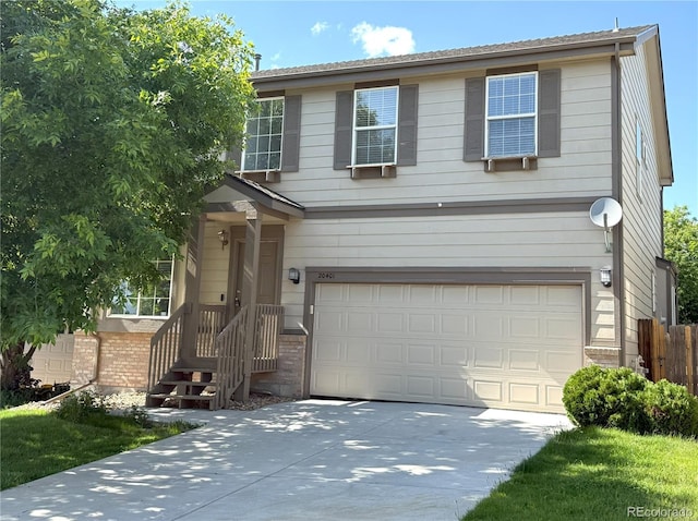 20401 E Chenango Pl, Aurora, CO 80015 - traditional-style home with a garage, driveway, and brick siding