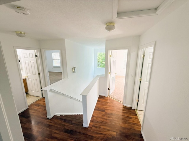 20401 E Chenango Pl, Aurora, CO 80015 - hall with an upstairs landing, dark wood-style floors, and attic access