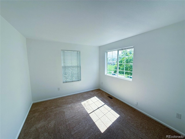 20401 E Chenango Pl, Aurora, CO 80015 - spare room with carpet floors and baseboards