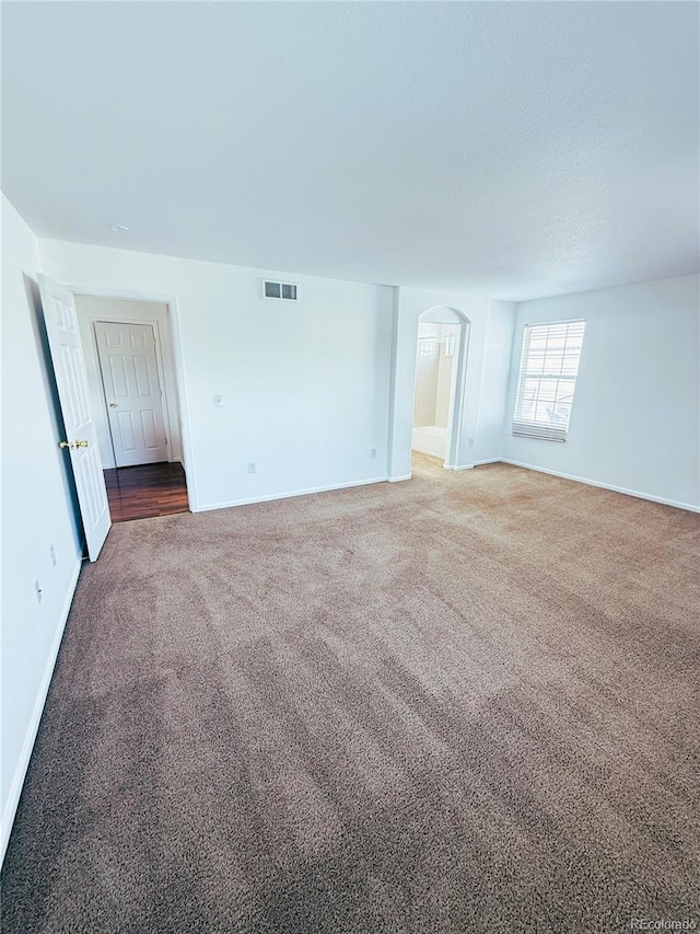 20401 E Chenango Pl, Aurora, CO 80015 - carpeted spare room featuring baseboards and arched walkways