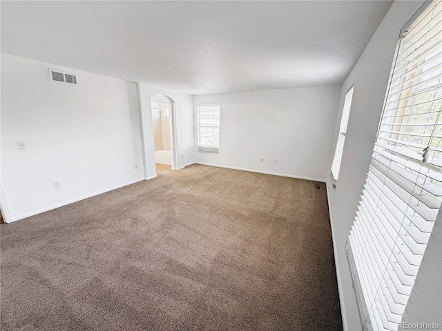 20401 E Chenango Pl, Aurora, CO 80015 - unfurnished room featuring arched walkways and carpet flooring
