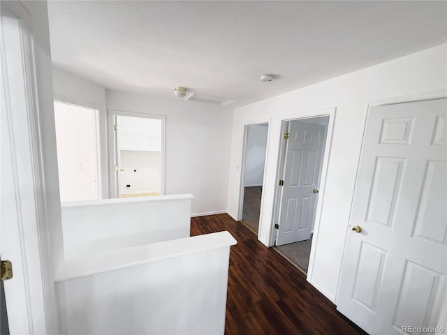 20401 E Chenango Pl, Aurora, CO 80015 - hall featuring dark wood-style flooring and baseboards