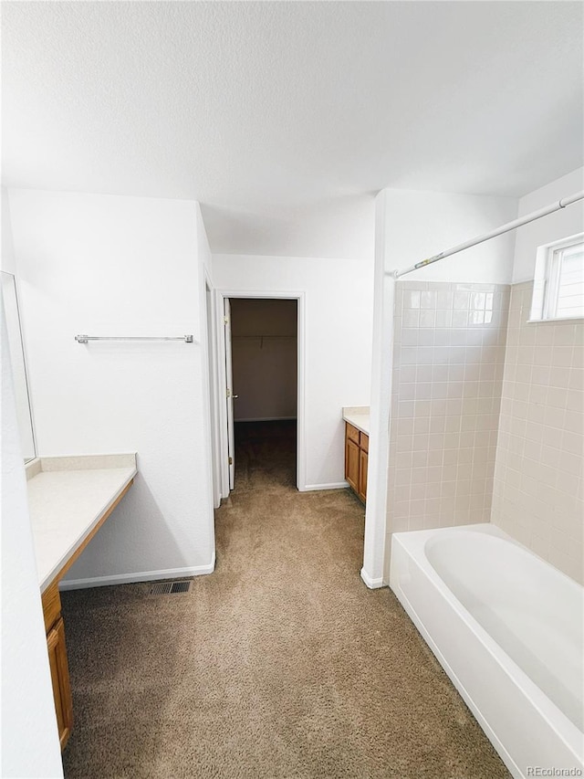 20401 E Chenango Pl, Aurora, CO 80015 - bathroom featuring vanity, bathing tub / shower combination, and carpet