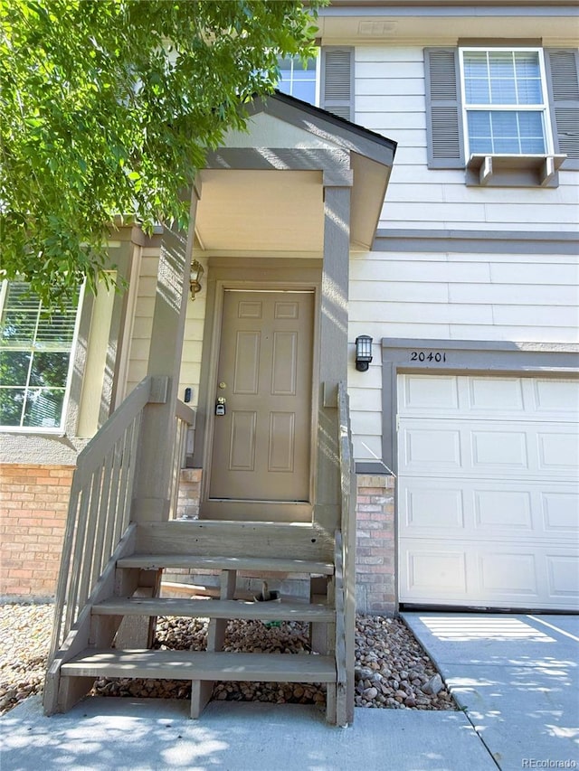 20401 E Chenango Pl, Aurora, CO 80015 - property entrance featuring a garage