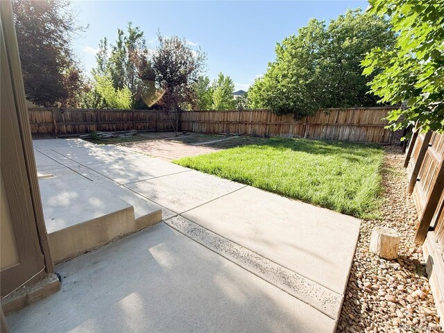 20401 E Chenango Pl, Aurora, CO 80015 - fenced backyard featuring a patio area