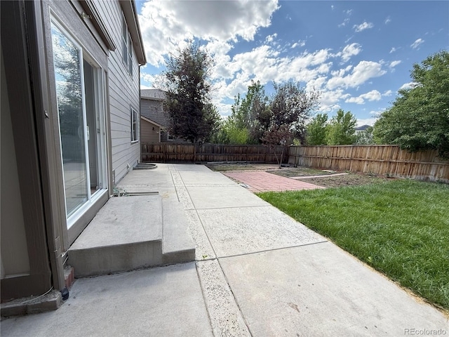 20401 E Chenango Pl, Aurora, CO 80015 - fenced backyard featuring a patio