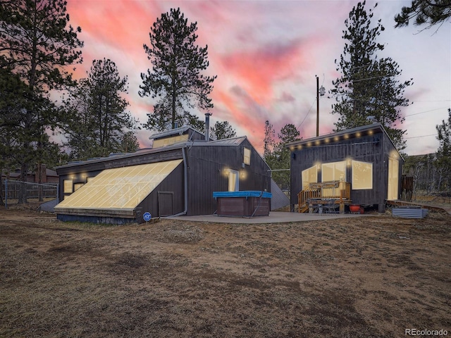 view of outdoor structure at dusk