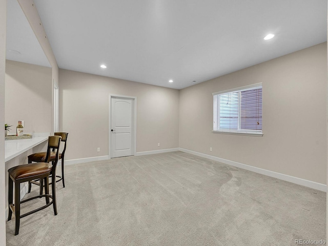 interior space featuring light colored carpet