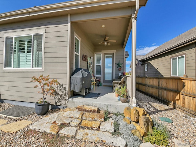 exterior space featuring area for grilling and ceiling fan