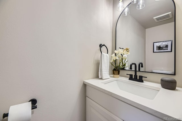 bathroom featuring visible vents and vanity