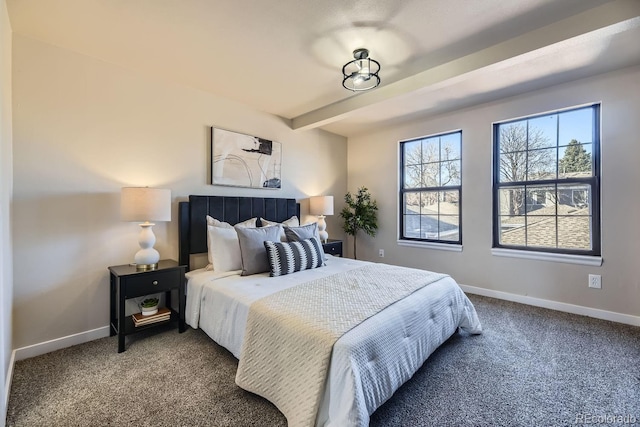 bedroom featuring beamed ceiling, carpet, and baseboards