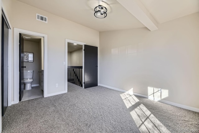 unfurnished bedroom featuring vaulted ceiling with beams, carpet, visible vents, and baseboards