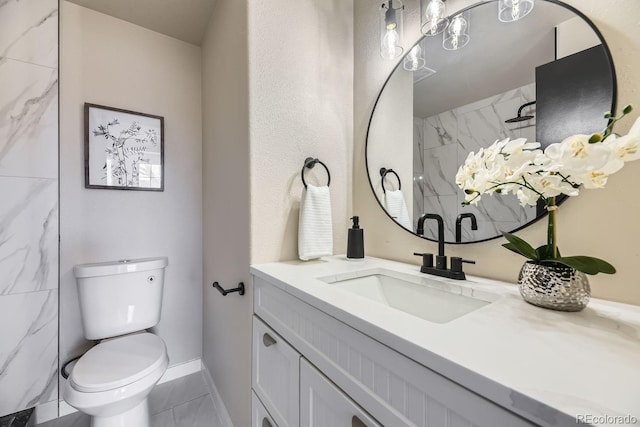 bathroom with a marble finish shower, vanity, and toilet