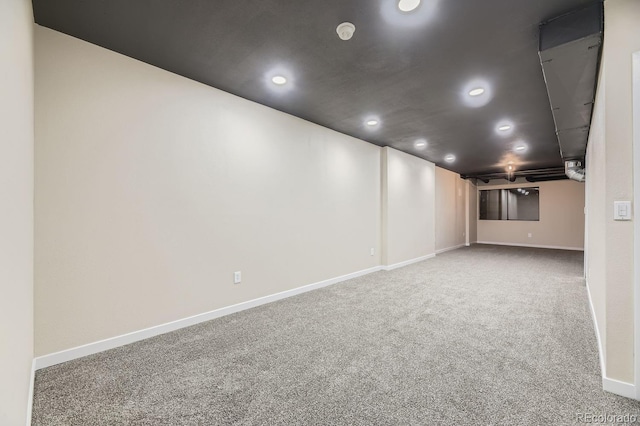 basement with carpet floors, recessed lighting, and baseboards