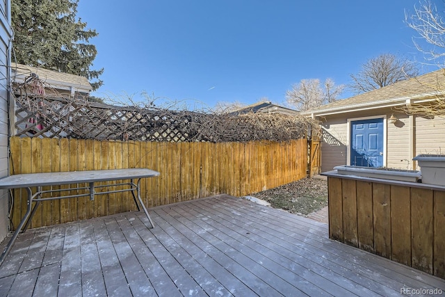 wooden terrace featuring fence