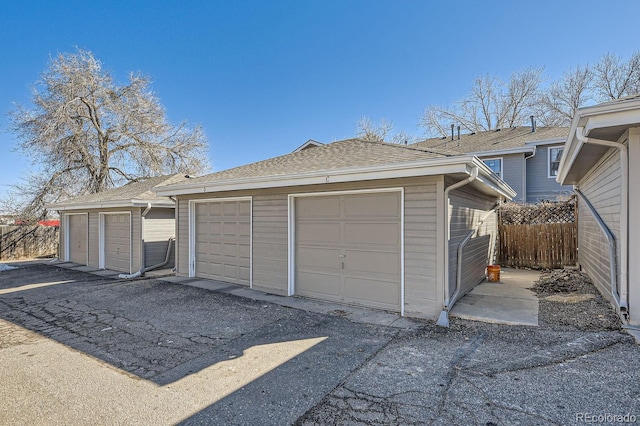 garage with fence