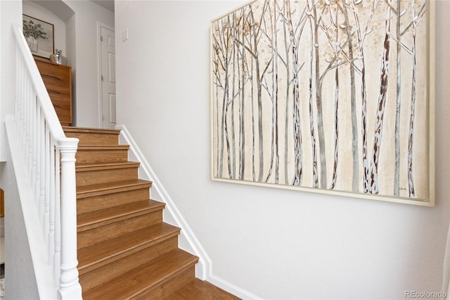 stairs with baseboards